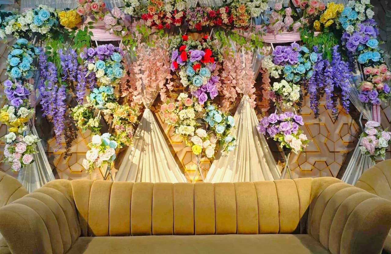 Floral canopy and decorated seating at Crystal Community Center, Gobindaganj