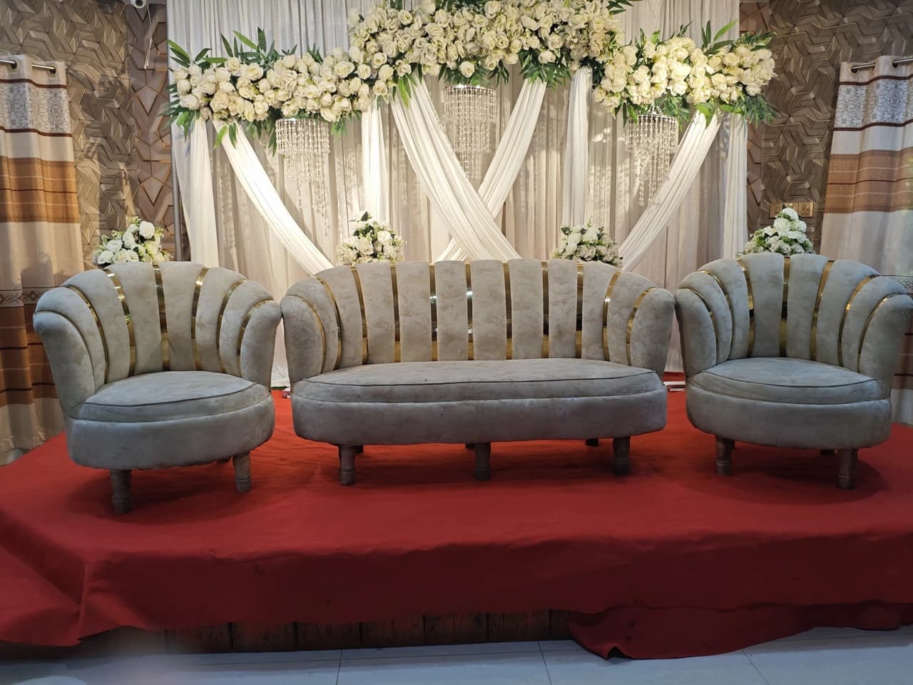 White floral wedding stage with grey seating at Crystal Community Center, Gobindaganj